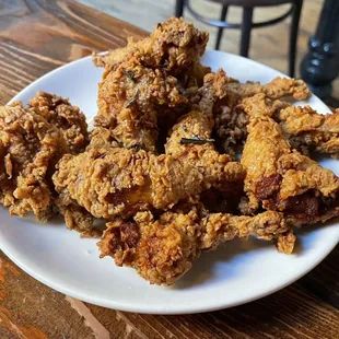 A dozen fried quail legs
