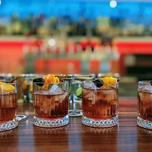 a row of glasses filled with drinks