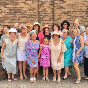 a large group of women posing for a picture