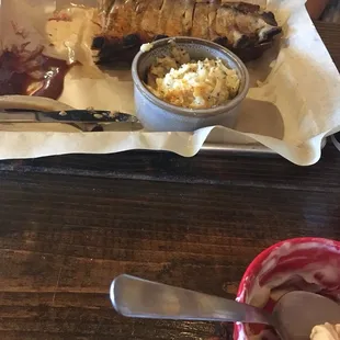 Half rack of ribs with a side of cheesy potatoes!