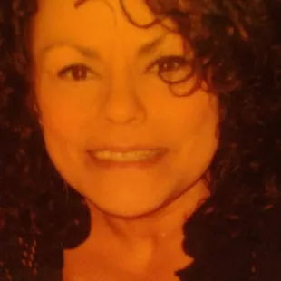 a woman with curly hair