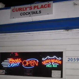 a neon sign in a window