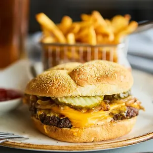 a cheeseburger and fries on a plate