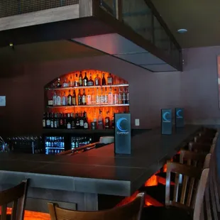 a bar with several bottles of alcohol