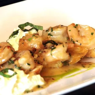 a plate of food with shrimp and mashed potatoes