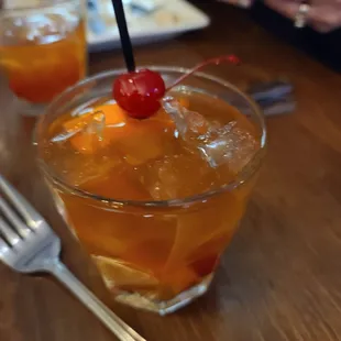 a drink with a cherry on top