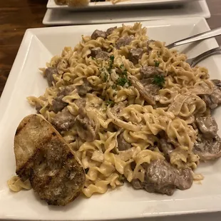 Beef stroganoff and linguine pescatore