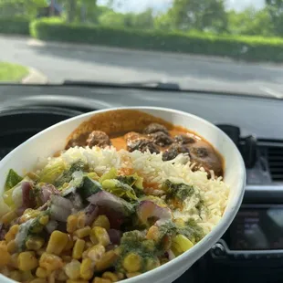 Bowl with lamb meatball and tikka misala sauce.