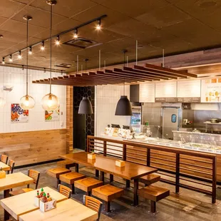a restaurant with wooden tables and benches