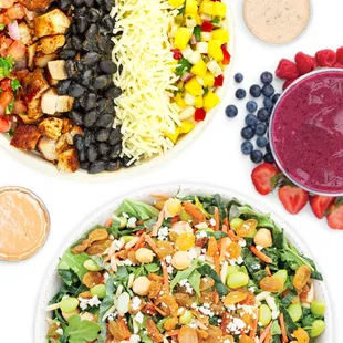 a bowl of salad and a bowl of dressing