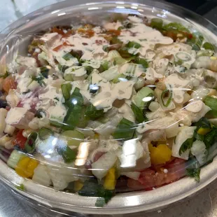 a salad in a plastic container