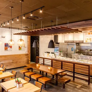 a restaurant with wooden tables and benches