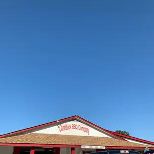 a truck parked in front of a restaurant