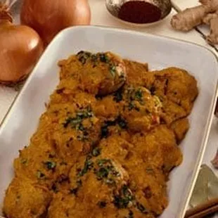 a dish of curry and onion