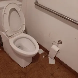 Unisex restroom. The toilet paper holder is so low. No toilet seat covers in restroom.
