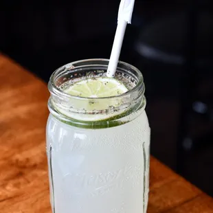 a mason jar with a toothbrush in it