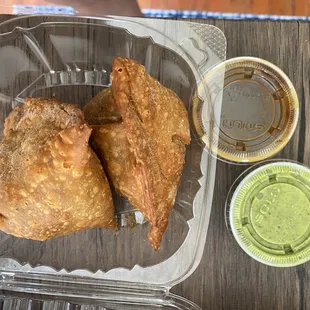 Traditional Samosas Plate with tamarind and cilantro raita
