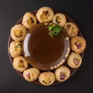 a plate of food with dipping sauce