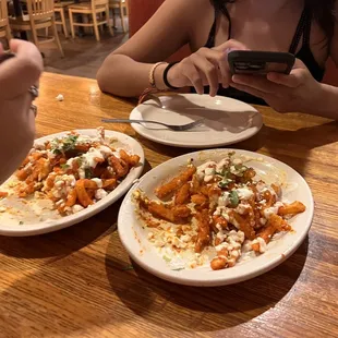 Tikka Masala Fries mid bite