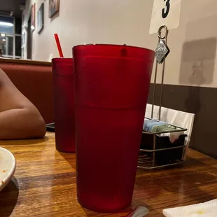 a red plastic cup and a plate of food