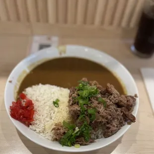 Beef belly curry with rice and fried egg