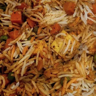 a close up of a plate of rice and vegetables