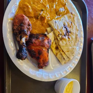 Chicken tiki masala, tandoori chicken and naan