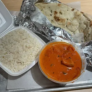 Tikka masala with rice and garlic naan