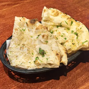 a plate of flatbreads on a wooden table