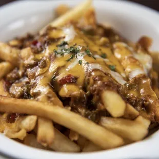 a bowl of chili cheese fries