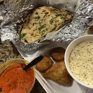 Chicken 16 oz. Chicken Tikka Masala, Plain Rice, Garlic Naan. I don't remember the names of the appetizers