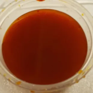 a close up of a sauce in a blender