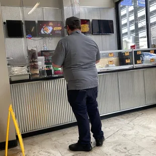 a man standing in front of a counter