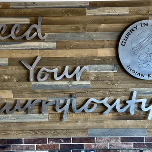a sign that reads feed your curiosity