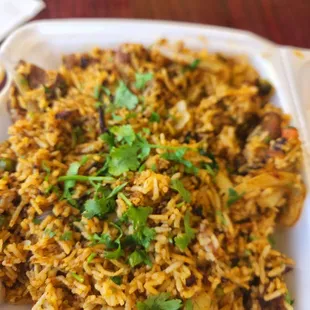 a plate of rice and vegetables