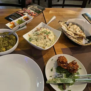 Saag Tofu, pilau rice, Garlic Naan, Butter Chicken, Onion Bhaji