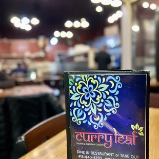 a menu on a table in a restaurant