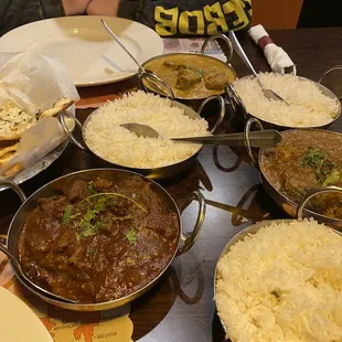 Garlic Nan, Basmati Rice, Curry Mango Duck Curry, and Goat Rogan Josh