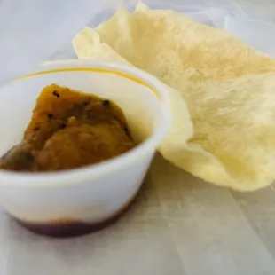 Complimentary papadum and hot pickle