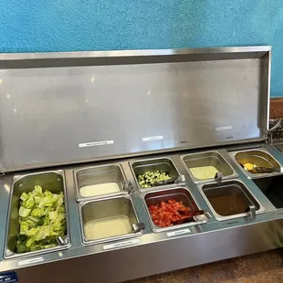 Salad bar (Romaine, cucumbers, tomatoes) sauces