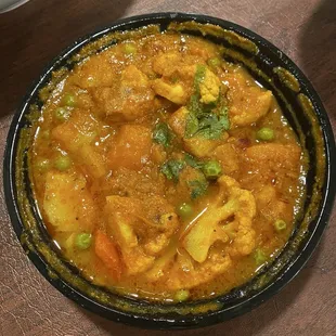 Aloo Gobi (vegan) Cauliflower and potato cooked in ginger tomaa as toes and peas--mildly spiced  Aloo Gobi Aloo Gobi Aloo Gobi
