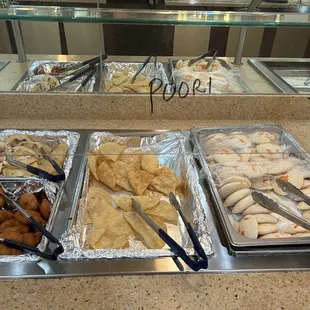 a variety of food items in a buffet