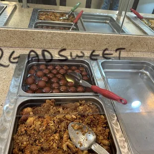 a variety of food items in a buffet