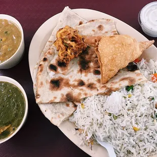 saag paneer, vegetarian korma, and a samosa