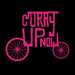 a pink bicycle with the words curry up now