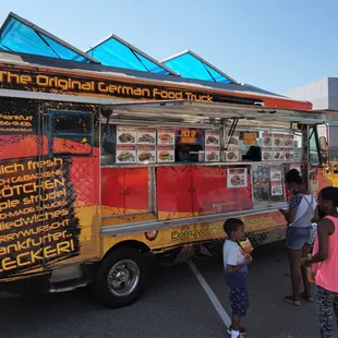 people ordering food from a food truck