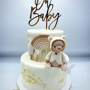 a cake with a teddy bear on top