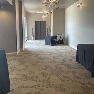 Elevator enters to long hallway. Perfect for a reunion that has a check in table.