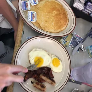 two plates of breakfast food