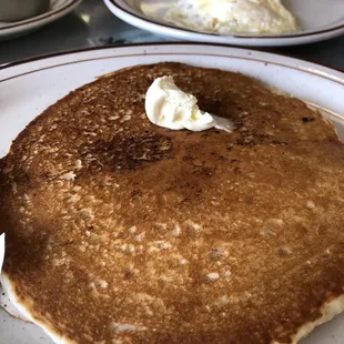 a plate of pancakes and eggs